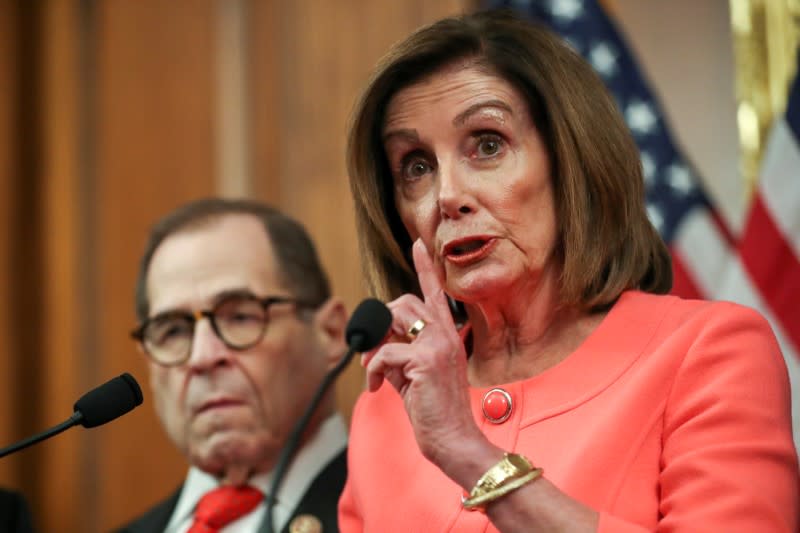 U.S. House Speaker Pelosi holds engrossment ceremony to sign Trump impeachment articles at the U.S. Capitol in Washington