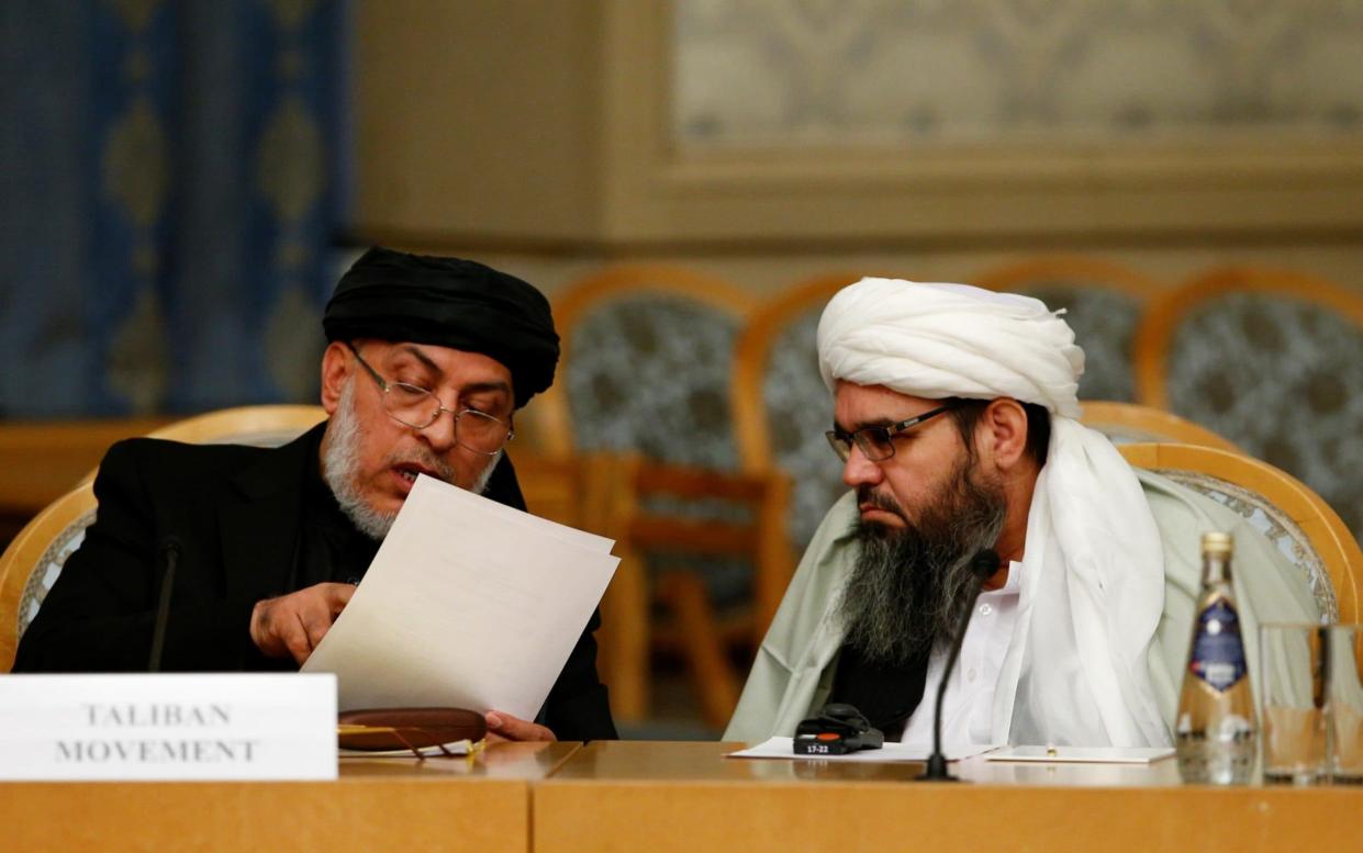 Head of Political Office of the Taliban Sher Mohammad Abbas Stanakzai, left, attends the second round in Moscow last year - Anadolu