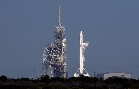 A SpaceX Falcon 9 rocket sits on the launch pad after being scrubbed due to a technical problem while due for a supply mission to the International Space Station from historic launch pad 39A at the Kennedy Space Center at Cape Canaveral, Florida, U.S., February 18, 2017. REUTERS/Mike Brown