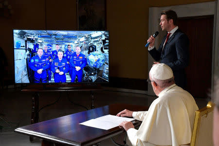 Pope Francis attends an audio-video connection with crew members of the International Space Station, ISS Expedition 53, at the Vatican October 26, 2017. Osservatore Romano/Handout via Reuters