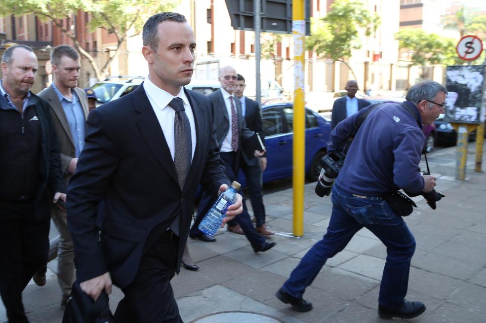 Oscar Pistorius leaves the high court in Pretoria, South Africa, Wednesday, May 14, 2014. Pistorius is charged with murder for the shooting death of his girlfriend, Reeva Steenkamp, on Valentines Day in 2013. A judge ruled on Wednesday, that Pistorius be sent for psychiatric observation. (AP Photo/Themba Hadebe)