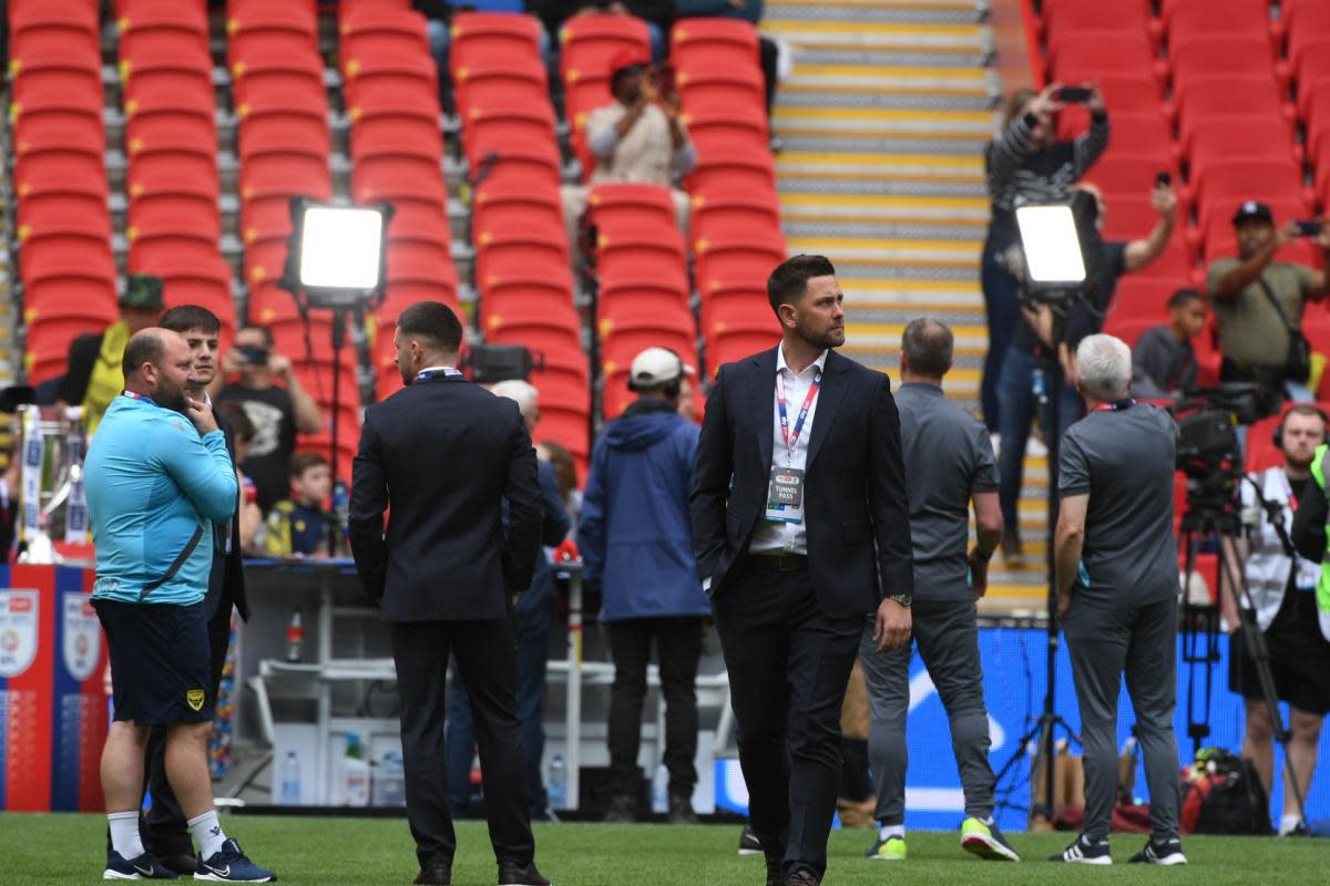 Oxford United head coach Des Buckingham inspects the pitch before kick-off <i>(Image: Mike Allen)</i>