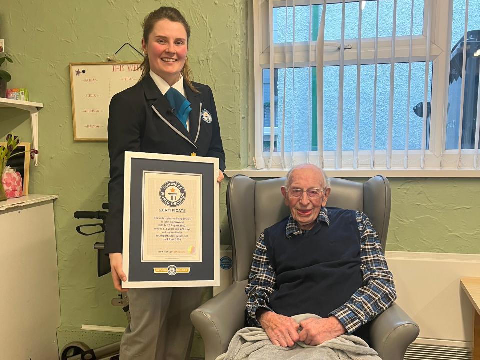 World's oldest man John Tinniswood receiving his certificate from Guinness World Records.