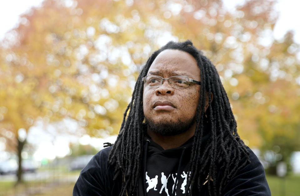 FILE - In this Oct. 17, 2019, file photo, Marlon Anderson poses for a photo in Madison, Wis. A Wisconsin school district is rehiring Anderson, a security guard after he was fired last week for repeating a racial slur while telling a student not to use it, a union official said Monday, Oct. 21. (Steve Apps/Wisconsin State Journal via AP)