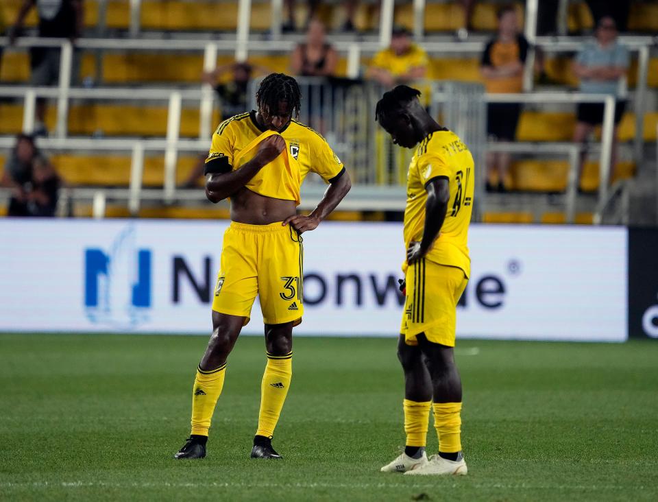 Aug 3, 2022; Columbus, Ohio, USA; Columbus Crew defender Steven Moreira (31) and Columbus Crew midfielder Yaw Yeboah (14) look towards the ground after losing 2-1 to CF Montreal during their MLS game at Lower.com Field in Columbus, Ohio on August 3, 2022. 