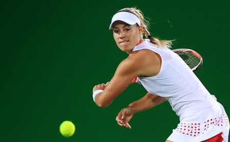 2016 Rio Olympics - Tennis - Final - Women's Singles Gold Medal Match - Olympic Tennis Centre - Rio de Janeiro, Brazil - 13/08/2016. Angelique Kerber (GER) of Germany in action against Monica Puig (PUR) of Puerto Rico. REUTERS/Toby Melville