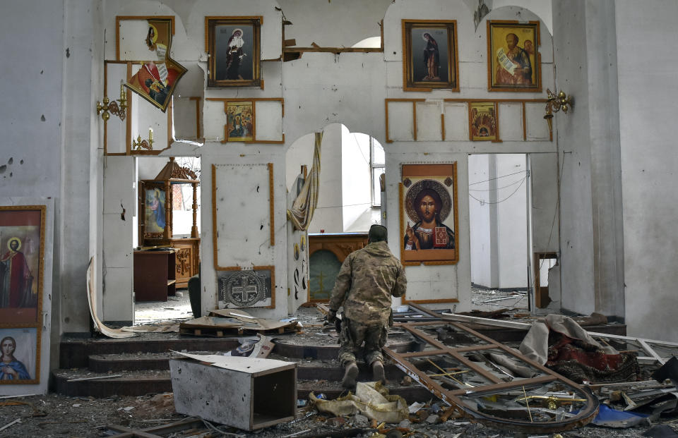 A Ukrainian serviceman kneels in prayer in a church damaged by a Russian air raid in Orikhiv, Zaporizhzhia region, Ukraine, April 5, 2024. (AP Photo/Andriy Andriyenko)