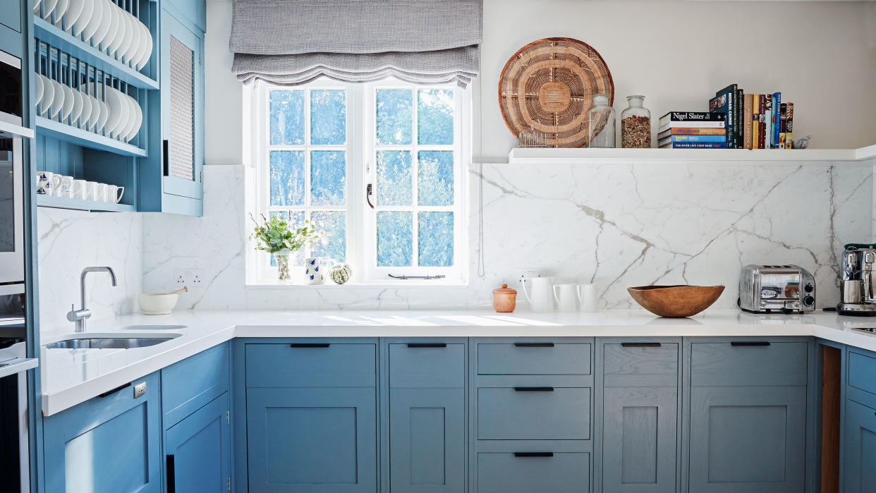  kitchen with blue cabinetry 