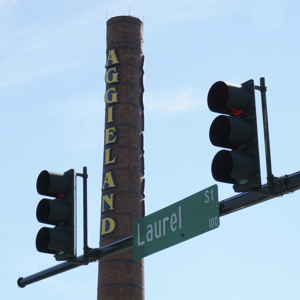A smokestack looms over Laurel Street on the campus of North Carolina A&T University in Greensboro, N.C., on Tuesday, March 19, 2019. Gerrymandering has cut the campus down the middle, with the 6th Congressional District on one side of the street and the 13th District on the other, both represented by Republicans. “It’s hard to explain to students who are already skeptical about the voting process ... that the state intentionally diluted their power in voting by putting this line back here in between our campus,” says Sophomore political-science major Kylah Guion. (AP Photo/Allen G. Breed)