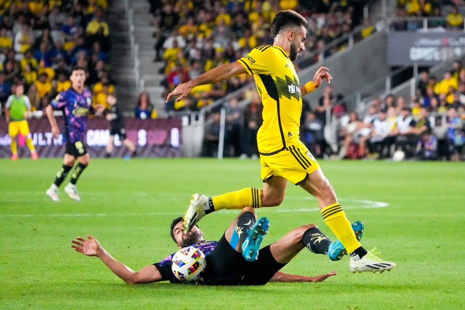 Sep 25, 2024; Columbus, Ohio, USA; Columbus Crew forward Diego Rossi (10) fights for the ball against Club América Néstor Alejandro Araujo Razor (14) in the first half of the Campeones Cup Final at Lower.com Field.