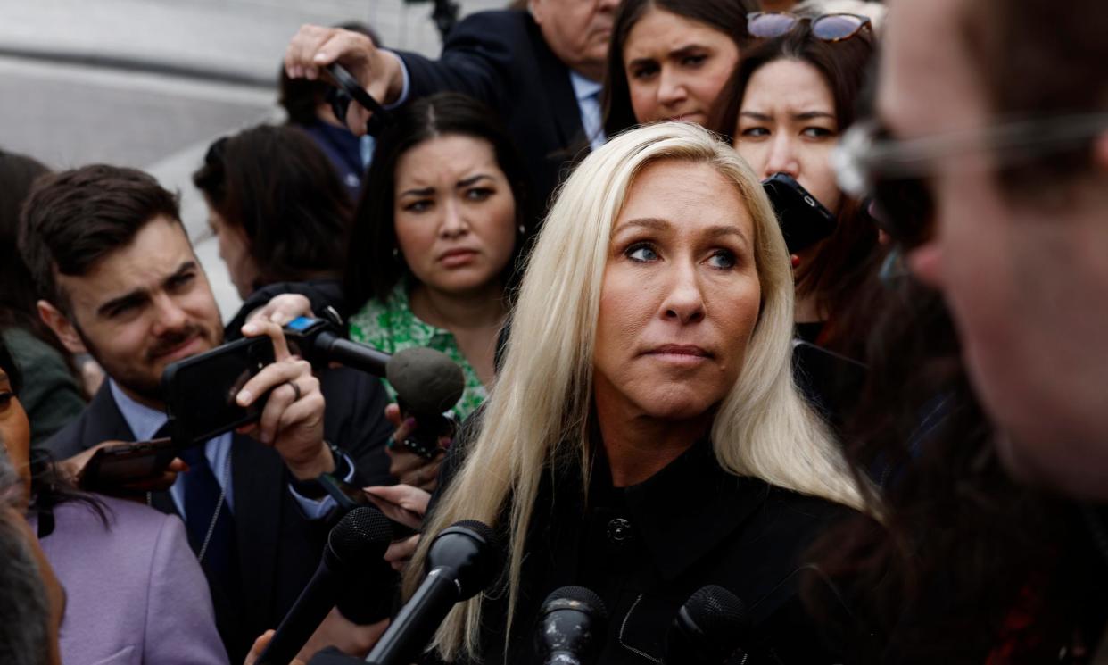 <span>Marjorie Taylor Greene speaks to a scrum of reporters outside the Capitol on Friday.</span><span>Photograph: Anna Moneymaker/Getty Images</span>