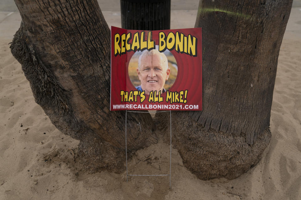 A sign opposing Los Angeles Councilman Mike Bonin, whose district includes Venice, is placed near a homeless encampment set up along the boardwalk in the Venice neighborhood of Los Angeles, Tuesday, June 29, 2021. The proliferation of homeless encampments on Venice Beach has sparked an outcry from residents and created a political spat among Los Angeles leaders. Residents fumed at City Councilman Mike Bonin, saying he neglected the area for too long. (AP Photo/Jae C. Hong)