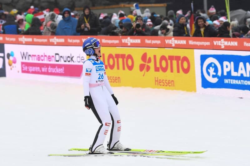 Austria's Jacqueline Seifriedsberger reacts after her jump during the Women's large hill competition of the Ski jumping World Cup in Willingen. Swen Pförtner/dpa