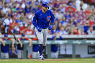 Chicago Cubs' P.J. Higgins tosses his bat as he draws an RBI-walk during the sixth inning of a baseball game against the Cincinnati Reds in Cincinnati, Wednesday, Oct. 5, 2022. (AP Photo/Aaron Doster)