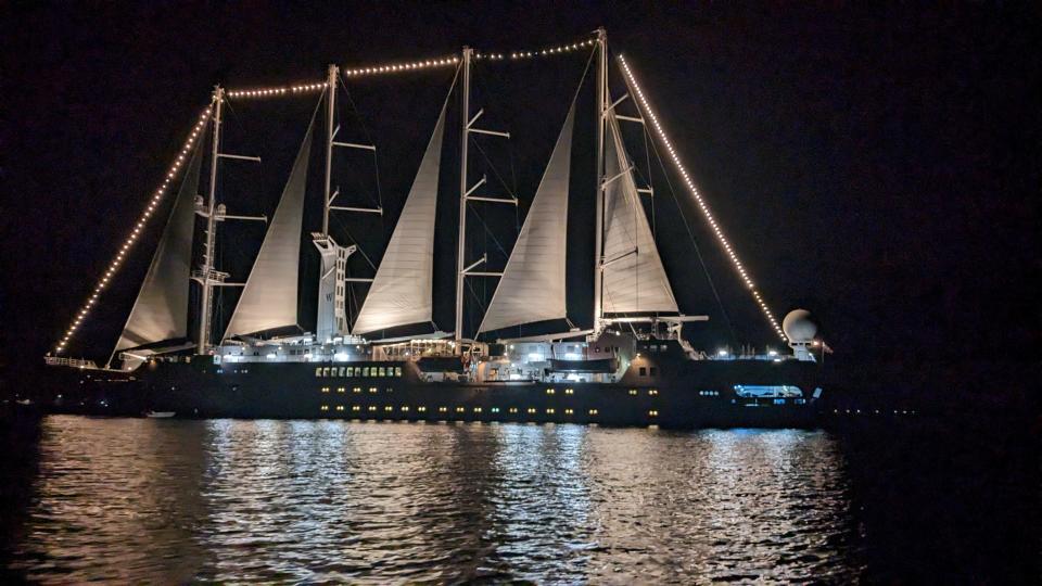 Windstar Wind Spirit ship lit up at night from the water
