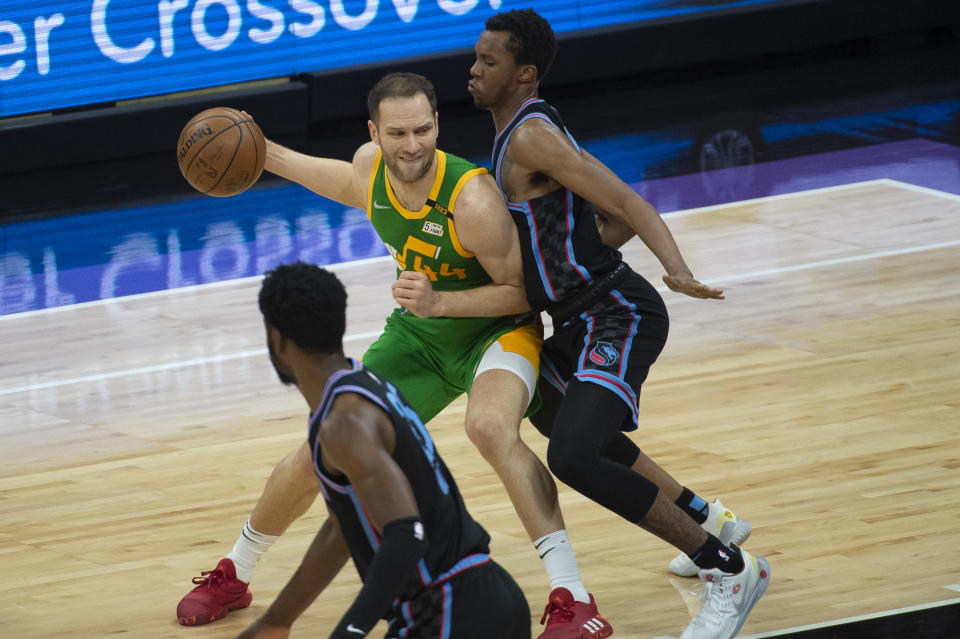 Utah Jazz forward Bojan Bogdanovic (44) is guarded by Sacramento Kings forward Louis King during the first quarter of an NBA basketball game in Sacramento, Calif., Sunday, May 16, 2021. (AP Photo/Randall Benton)