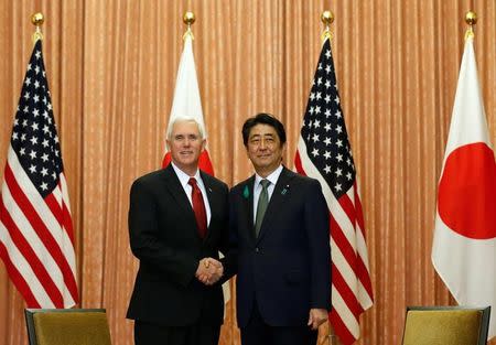 U.S. Vice President Mike Pence (L) meets with Japan's Prime Minister Shinzo Abe at Abe's official residence in Tokyo, Japan, April 18, 2017. REUTERS/Kim Kyung-Hoon