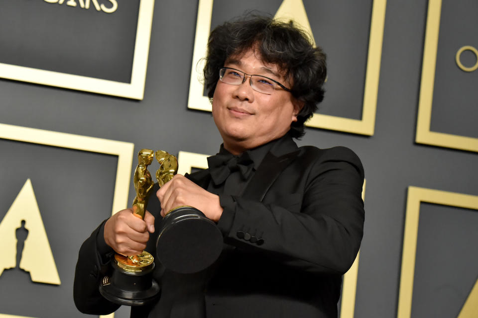 Bong Joon Ho with two of his Oscars for "Parasite" at the 2020 Academy Awards. (Photo: Jeff Kravitz via Getty Images)