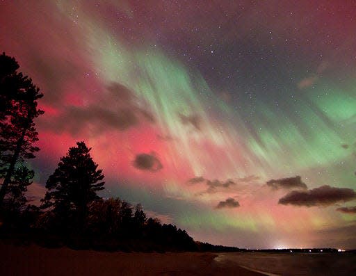 The skies above Lake Michigan are lit up by the Northern Lights.