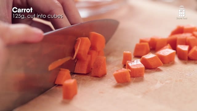 Chopping carrots into small pieces