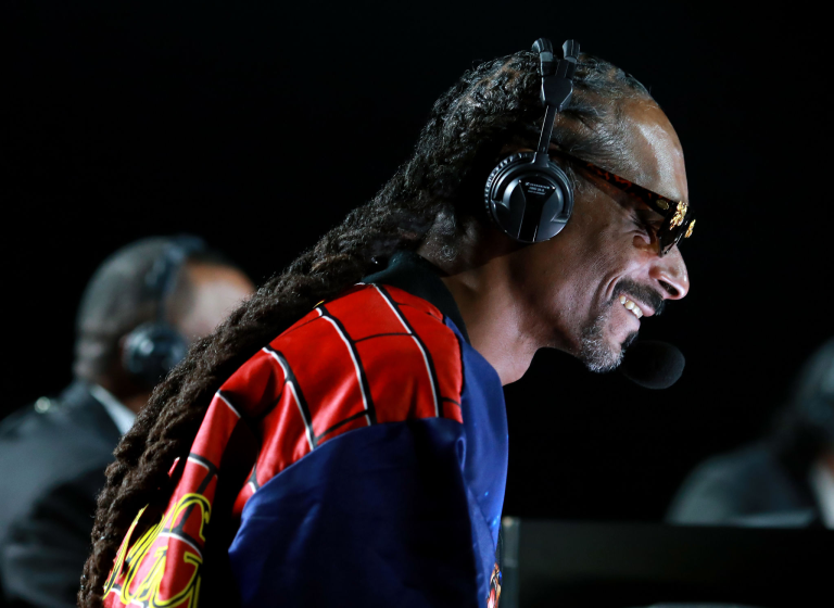 Snoop Dogg provides some boxing commentary during the Mike Tyson vs Roy Jones Jr. event.