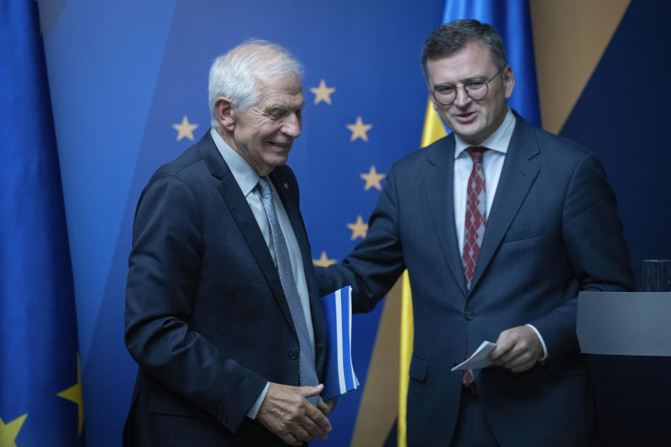Ukrainian Foreign Minister Dmytro Kuleba, right, and EU High Representative for Foreign Affairs Josep Borrell talk during informal EU Foreign Ministers meeting in Kyiv, Ukraine, Monday, Oct. 2, 2023. Some of Europe's top diplomats have gathered in Kyiv in a display of support for Ukraine's fight against Russia's invasion as signs emerge of political strain in Europe and the United States about the war. (AP Photo/Efrem Lukatsky)