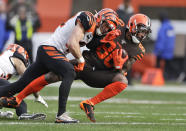 Cincinnati Bengals defensive back Clayton Fejedelem (42) tackles Cleveland Browns wide receiver Jarvis Landry (80) during the first half of an NFL football game, Sunday, Dec. 8, 2019, in Cleveland. (AP Photo/Ron Schwane)