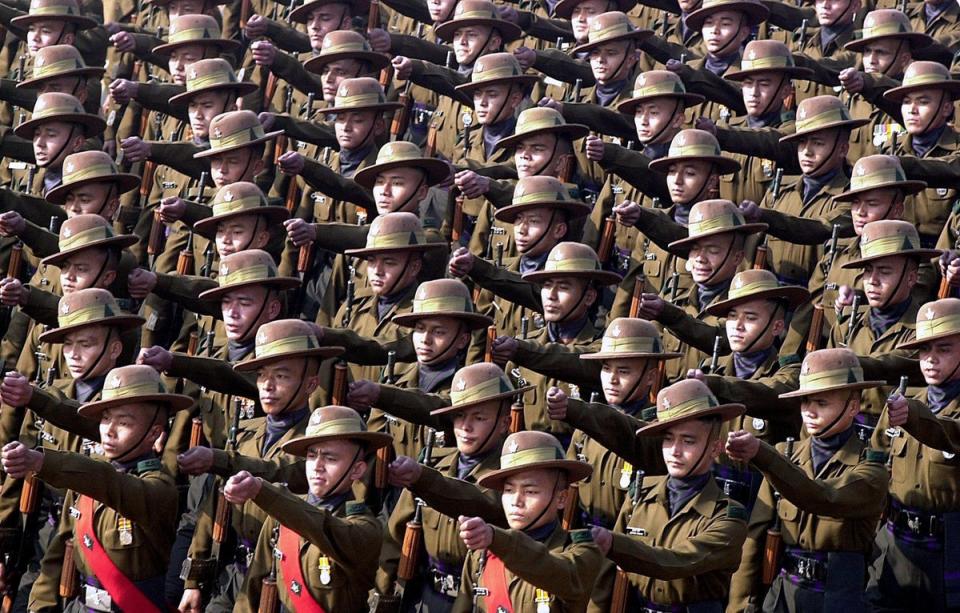 Indian army soldiers belonging to the Gurkha regiment march during the full dress rehearsal in New Delhi, 23 January 2001 (AFP via Getty Images)