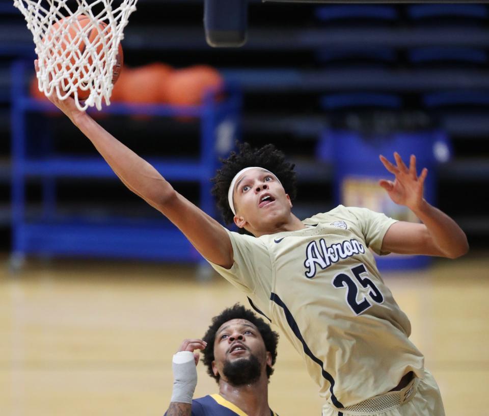 Akron Enrique Freeman shoots against Kent State in the second half at Rhodes Arena, Friday, Jan. 1, 2021.