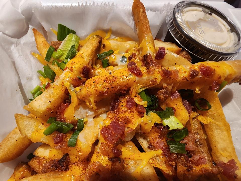 Loaded fries in takeout container