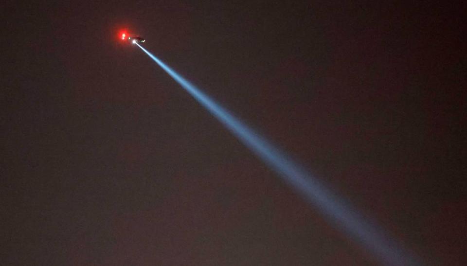 A helicopter hovers over I-540 in Raleigh, N.C., Thursday, October 13, 2022.