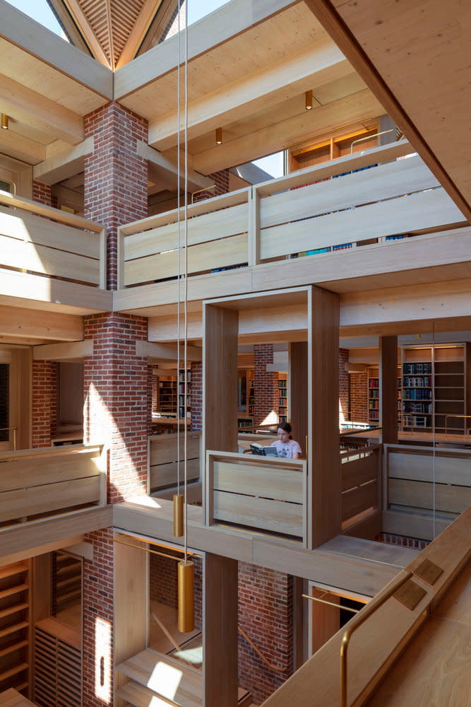 The new library is sustainably designed to allow plenty of natural light and airflow through vertical spaces like this one. 