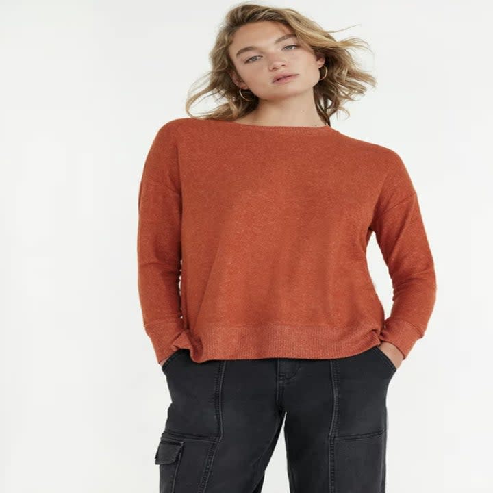 An orange knit pullover