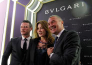 Actor Luke Evans, former French president Nicolas Sarkozy's wife Carla Bruni-Sarkozy and Bulgari Chief Executive Jean-Christophe Babin pose during a ribbon cutting ceremony to celebrate the opening of a new Bulgari store in Moscow, Russia, May 24, 2016. REUTERS/Maxim Shemetov