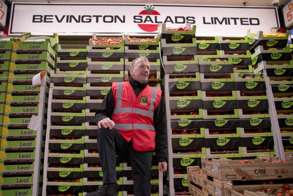 Gary Marshall of Bevington Salads and the Chairman of the Tenants Association, poses for a picture at his stall in New Covent Garden Market, in London, Monday, Jan. 4, 2021. Wholesale fruit and vegetables traders are expecting there will be shortages, as a result of Brexit after they have already been severely hit by the pandemic shutting many businesses they supply to, in New Covent Garden Market. (AP Photo/Alberto Pezzali)