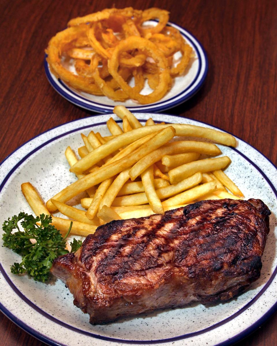 The 16-ounce Yankee's New York strip with fries and onion rings served at Jesse's Embers.