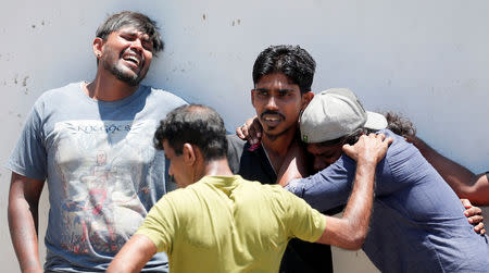 Relatives of a victim of the explosion at St. Anthony's Shrine, Kochchikade church react at the police mortuary in Colombo, Sri Lanka April 21, 2019. REUTERS/Dinuka Liyanawatte