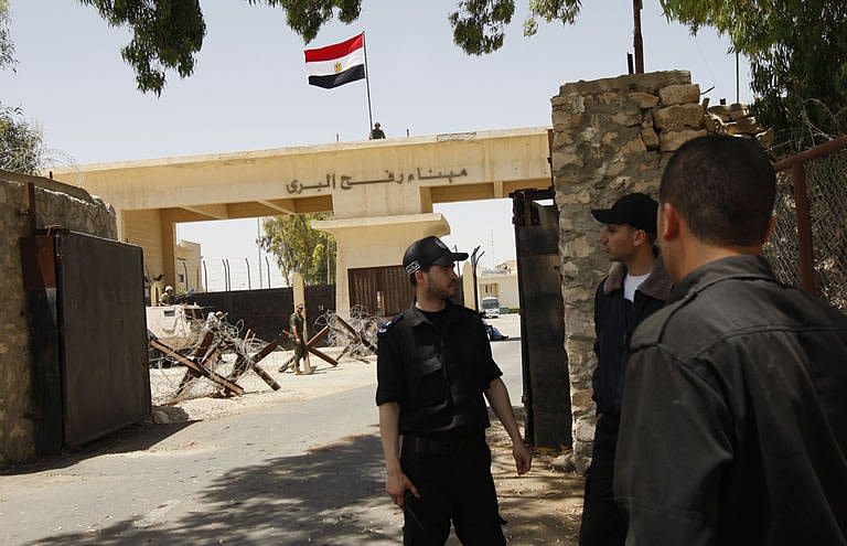 Palestinian border policemen stands close to the Rafah border crossing with Egypt in the southern Gaza Strip as Egypt reopened the border. Egypt on Saturday reopened its Rafah border crossing with Gaza, allowing people to cross freely for the first time in four years, in a move hailed by Hamas but criticised by Israel