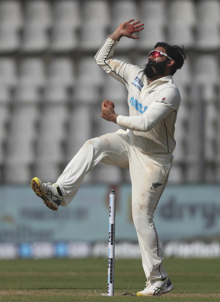 New Zealand's Ajaz Patel bowls during the day three of their second test cricket match with India in Mumbai, India, Sunday, Dec. 5, 2021.(AP Photo/Rafiq Maqbool)