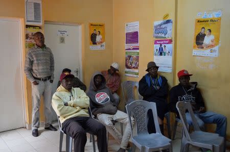 Patients watch television at Nairobi Outreach Services Trust (NOSET) in Nairobi, Kenya, July 13, 2016. REUTERS/Neha Wadekar