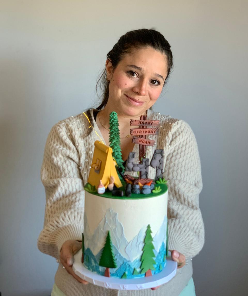 Ellen Aguiar takes pride in her custom made cake.