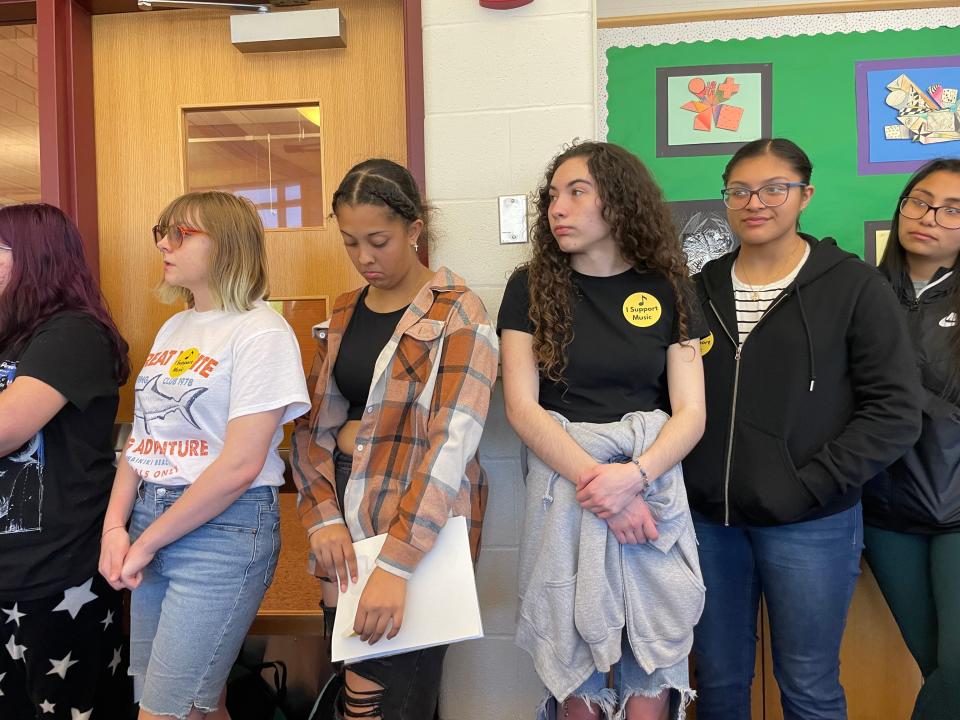 A group of Norwich Free Academy students supporting music education in Norwich Public Schools during a Board of Education meeting on April 16.