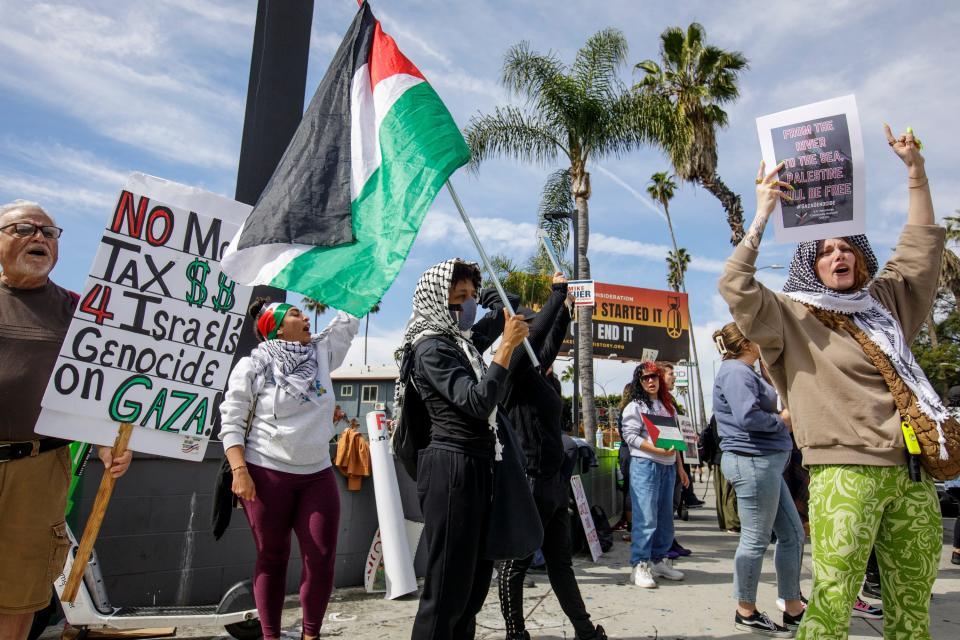 Demonstrators protest against the Israel-Gaza war during the 96th Academy Awards near the Dolby Theatre at Ovation Hollywood in Los Angeles, California.