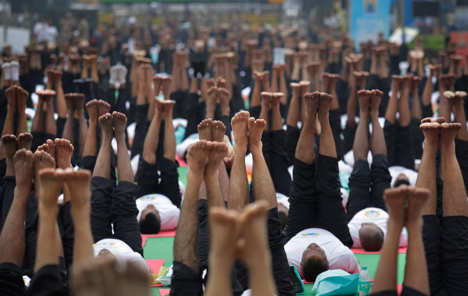 <p>Indians perform Yoga to mark the International Yoga Day in New Delhi, India, Wednesday, June 21, 2017. (Photo: Manish Swarup/AP) </p>