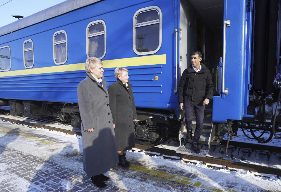 Britain's Prime Minister Rishi Sunak, right, arrives in Kyiv, Ukraine, to meet with President Volodymyr Zelensky to announce a major new package of military aid to Ukraine, on Friday Jan. 12, 2024. (Stefan Rousseau/Pool via AP)
