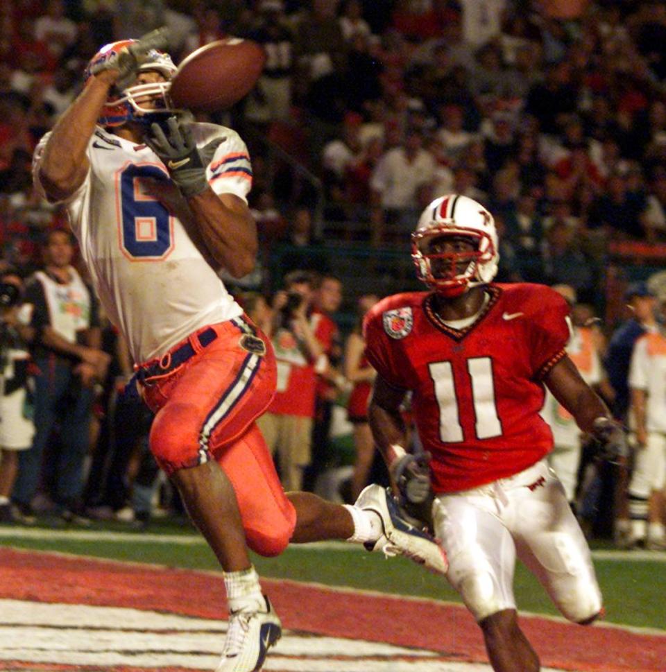 UF’s Taylor Jacobs (WR) leaps for a touchdown catch over Maryland’s Tony Okanlawon during the Gators’ 2002 Orange Bowl Game victory.