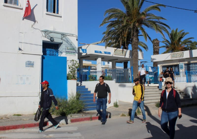 FILE PHOTO: People leave a train station, as Tunisia relaxes some of its lockdown rules while keeping other restrictions in place, as preventive measures against the spread of the coronavirus disease (COVID-19), in La Marsa near Tunis