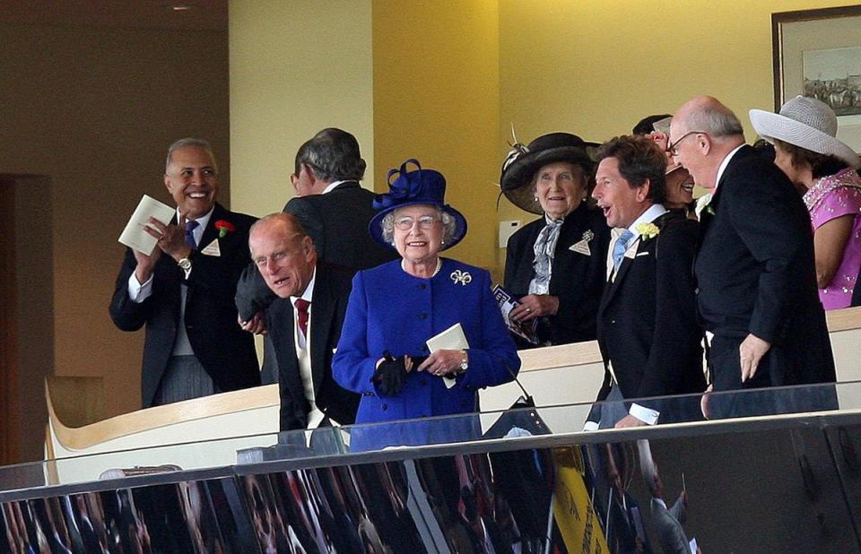 The Queen watches as Free Agent, ridden by Richard Hughes, wins the Chesham Stakes at Ascot in 2008 (Steve Parsons/PA)