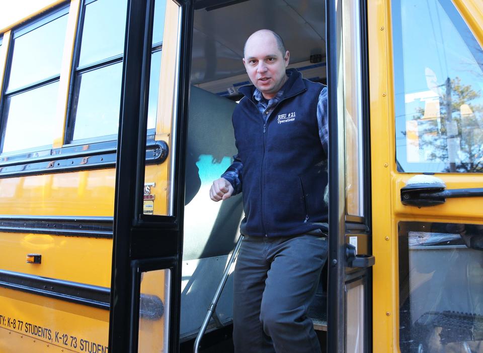 Chris Pasciuto, Director of Transportation of RSU 21 shows off one of the buses in the school district's fleet and talks about the shortage of drivers.