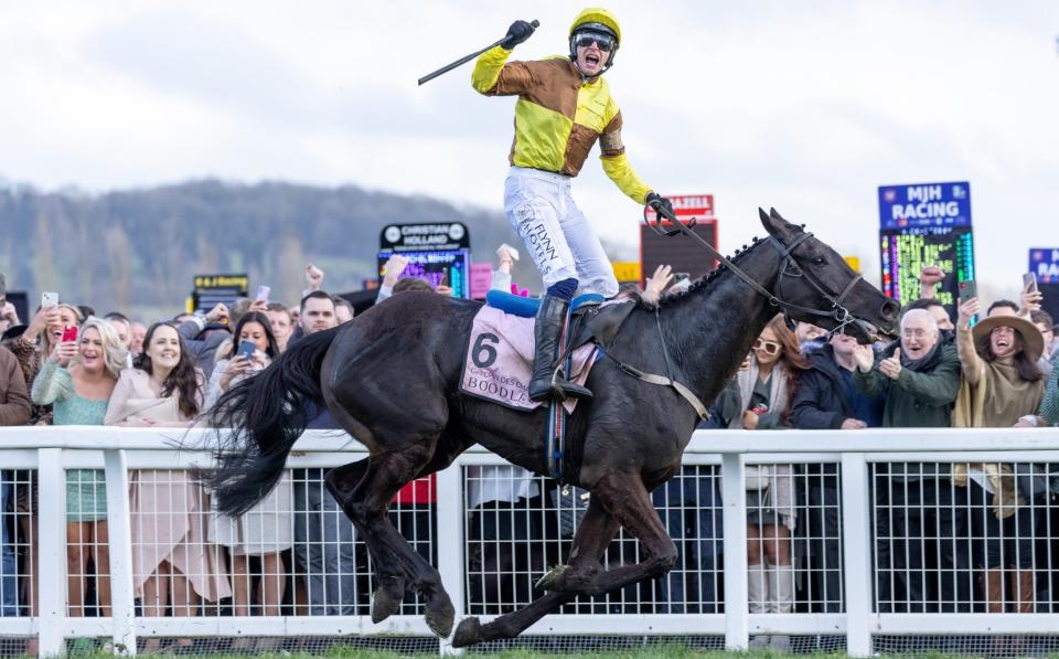 Jockey, Paul Townend on Galopin Des Champs celebrates winning the Boodles Cheltenham Gold Cup Steeple Chase during day four, Gold Cup Day, of the Cheltenham Festival 2023 at Cheltenham Racecourse on March 17, 2023 in Cheltenham, England